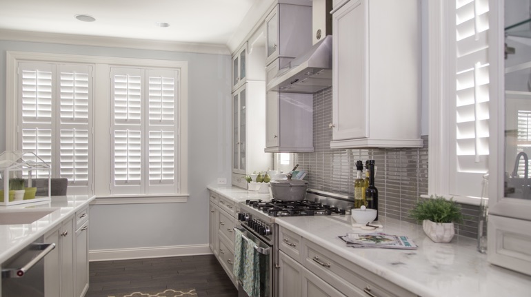 Plantation shutters in Washington DC kitchen with marble counter.